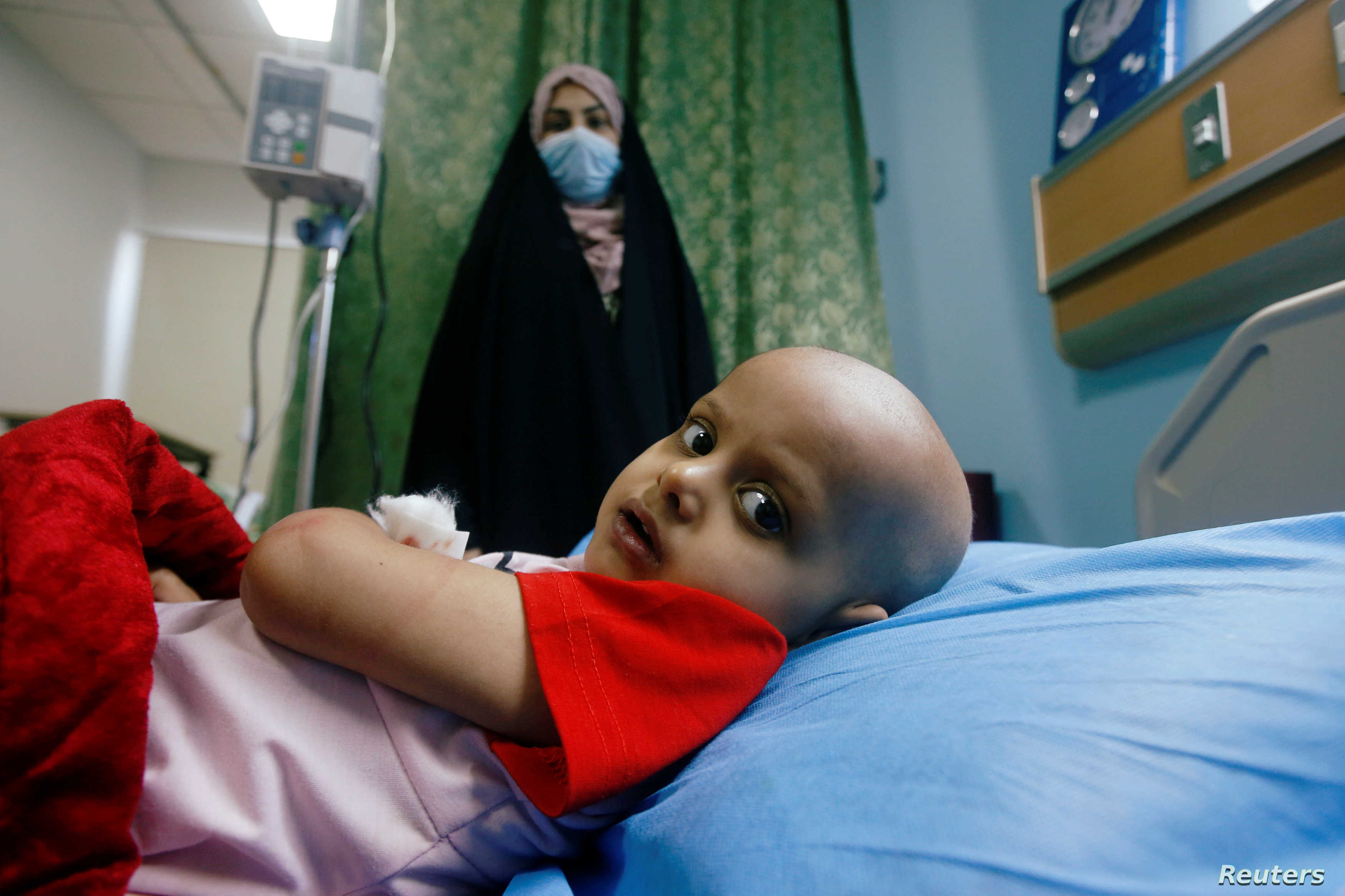 A child who suffers from cancer lies on a bed at the Children's Hospital for Cancer Diseases, amid the spread of the coronavirus disease (COVID-19), in Basra, Iraq July 9, 2020. Picture taken July 9, 2020. REUTERS/Essam Al-Sudani